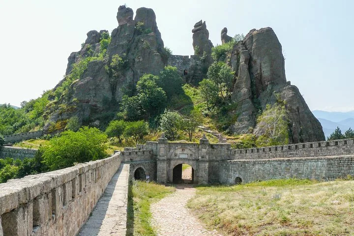 Belogradchik Fortress integrated with massive rock formations, featuring stone walls and gates.